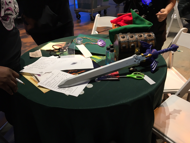 Our table, complete with puzzles, gear, and the Master Sword that we won.